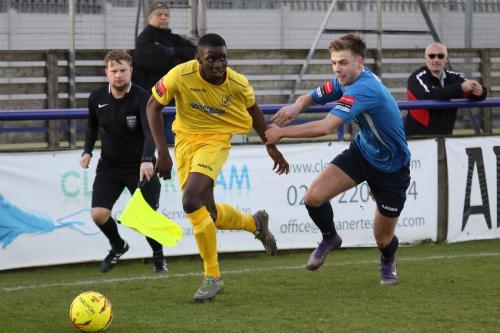 Enfields Percy Kiangebeni (L) leaves Alfie Young in his wake