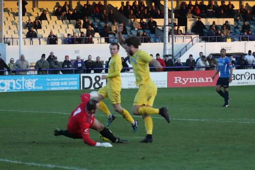 Harry Ottaway rounds Wingate keeper Shane Gore to score his second goal