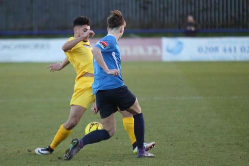 Wingates Alfie Young (R) and Enfields Samir Bihmoutine