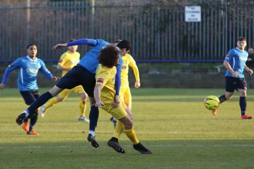 Wingates Claudiu Vilcu (L) and Enfields Harry Ottaway