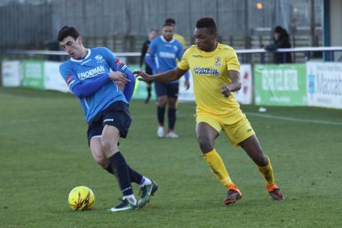 Wingates Claudiu Vilcu (L) and Enfields Karl Oliyide