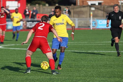 Enfields Bobby Devyne (yellow) runs at Matt Boiling