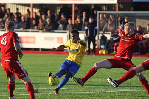 Enfields Bobby Devyne curls a shot fractionally wide