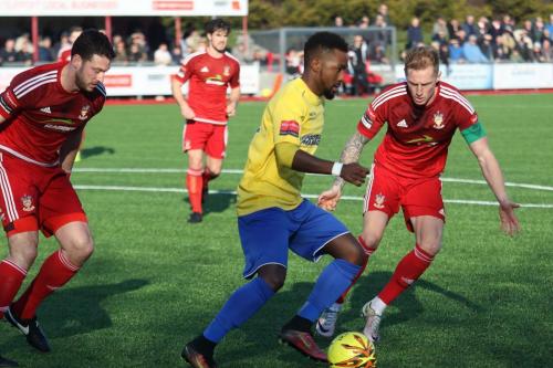 Enfields Bobby Devyne marked by Kane Wills (R) and Gary Elphick