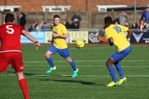 Enfields Karl Oliyide (R) and Billy Crook and Worthings Gary Elphick