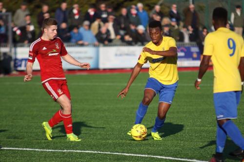 Enfields Karl Oliyide (centre