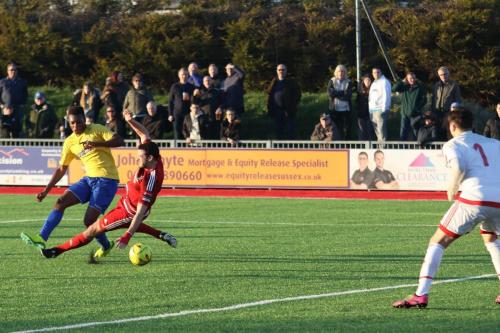 Enfields Karl Oliyide shoots through Gary Elphicks legs but Kieron Thorp saves comfortanly