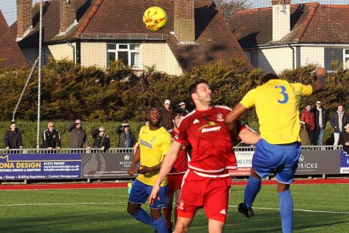 Enfields Ricky Gabriel (3) hits the Worthing bar with a header