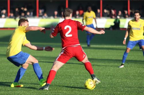 Enfields Scott Shulton (yellow) challenges Matt Boiling