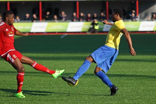 Worthings David Ajiboye (L) and Enfields Ricky Gabriel