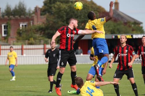 Brightlingseas Matt Cripps (L) challenges Ryan Blake