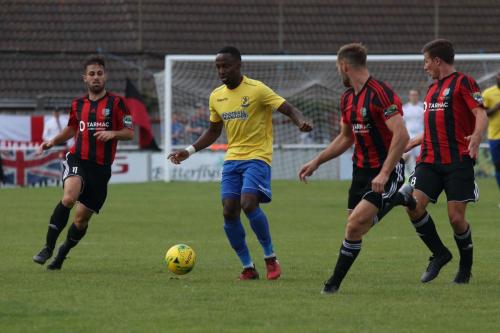 Enfields Ryan Blake (yellow) and (L-R) Brightlingseas Aaron Condon, Jake Gould and James Love