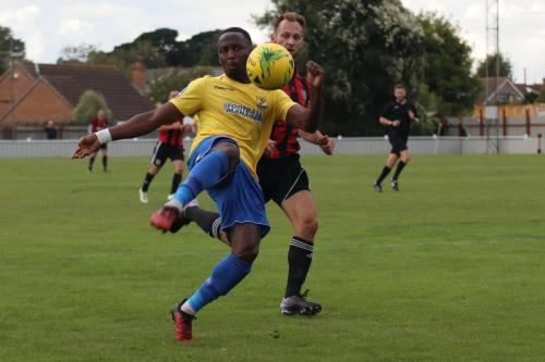 Enfields Ryan Blake (yellow) and Brightlingseas Jake Gould