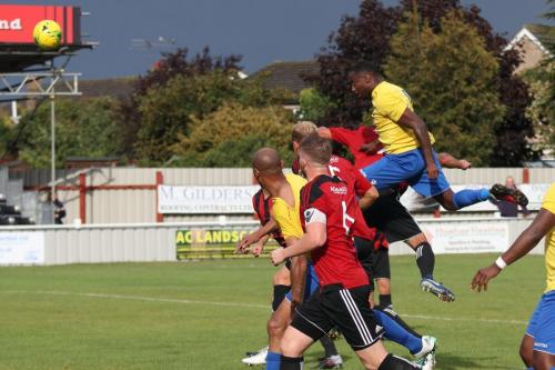 Enfields Ryan Blake (yellow) heads wide