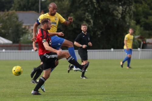 Enfields Simon Thomas (yellow) and Brightlingseas Jake Gould