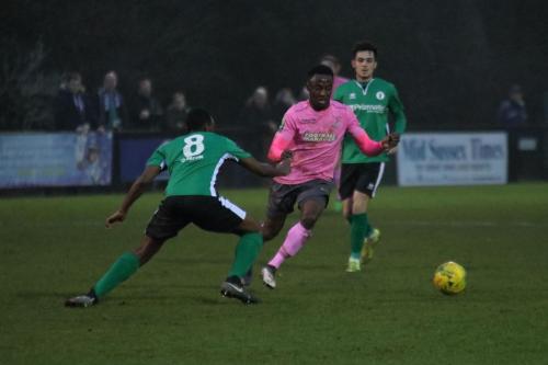 Enfields Ryan Blake (pink) runs at Ibrahim Diallo