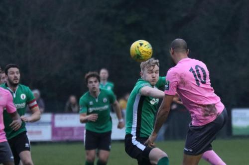 Enfields Simon Thomas (10) challenges Pat Harding