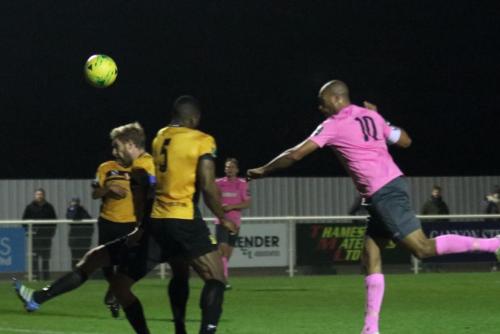 Enfields Simon Thomas (R) heads on goal