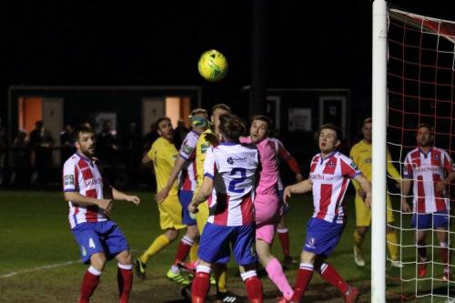 All eyes on the ball as it curls wide of the post