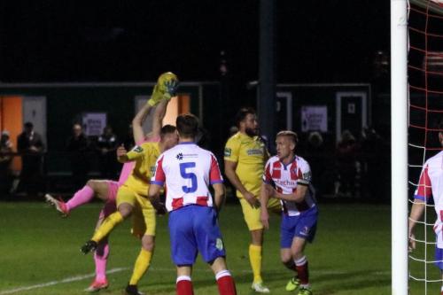 Dorking keeper Slavomir Huk catches under pressure
