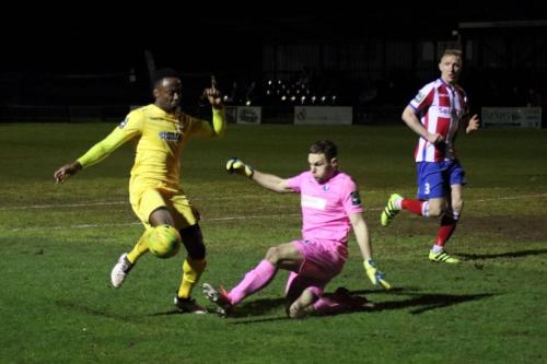 Dorking keeper Slavomir Huk clears from Ryan Blake12