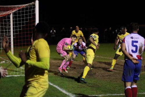 Dorking keeper Slavomir Huk collects a shot