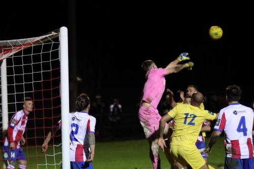Dorking keeper Slavomir Huk punches clear but the ball falls to Junior Mubiayi who makes the score 2-2