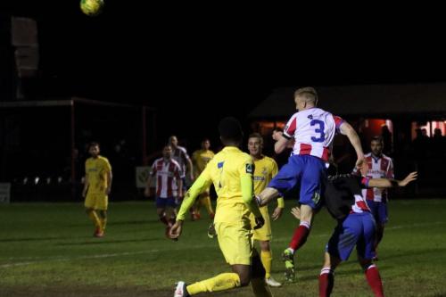 Dorkings Chris Boulter heads clear