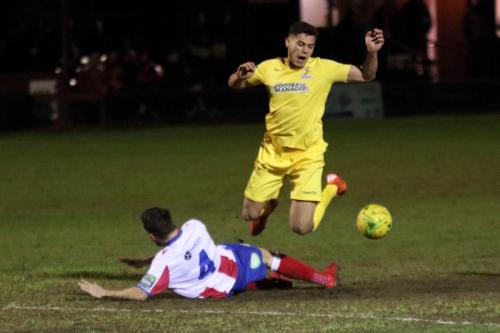 Dorkings Dean Hamlin (4) earens a yellow card with a challenge on Samir Bihmoutine