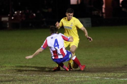 Dorkings Dean Hamlin (4) earens a yellow card with a challenge on Samir Bihmoutine13