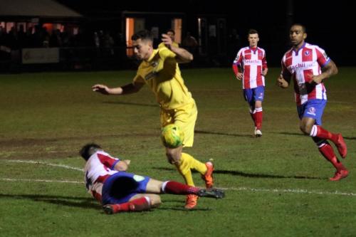 Dorkings Dean Hamlin tackles Samir Bihmoutine