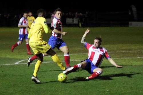 Dorkings Jerry OSullivan (R) challenges Ryan Blake