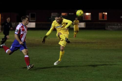 Enfields Liam Hope (R) sends an attempted lob over the crossbar