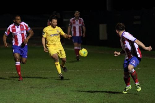 Enfields Mario Noto and Dorkings Jerome Beckles (L) and Jerry OSullivan