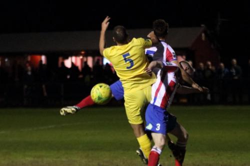 Enfields Mat Mitchel-King (yellow) challenges Chris Boulter (R) and David Ray
