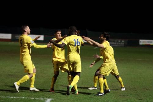 Junior Mubiayi (16) receives the congratulations of teammates after his first senior goal rescued a point for Enfield