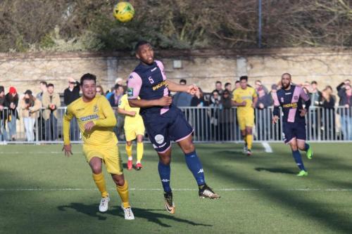 Dulwichs Rickie Hayles (R) beats Liam hope to a long ball