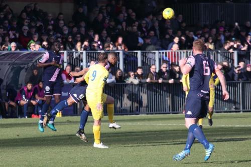 Dulwichs Rickie Hayles heads clear from Liam Hope (9)