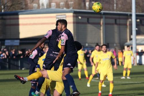 Enfields Dan Rumens (yellow) is beaten by Michael Onuvwigun (L) and Quade Taylor