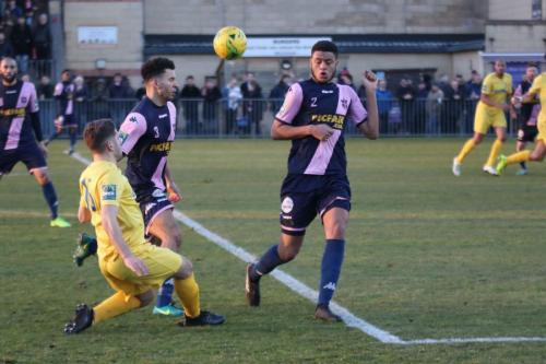 Enfields John Kyriacou and Dulwichs Quade Taylor (R) and Nathan Green