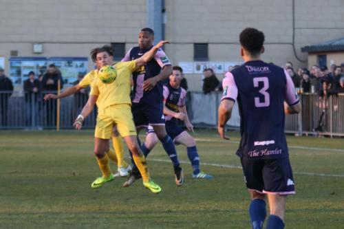 Enfields Sam Youngs chests the ball down under pressure from Rickie Hayles