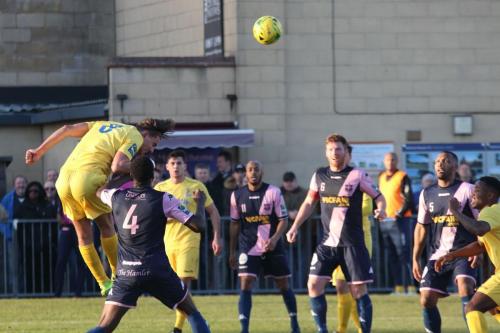 Enfields Sam Youngs heads against the post