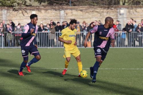Enfields Tyler Campbell and Dulwichs Nathan Ferguson (L) and Sanchez Mings