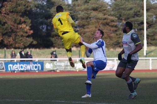 Enfields Liam Hope lifts the ball over Manny Agboola and into the net but is given offside, is clattered by Agboola and immediately substituted