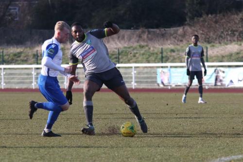 Enfields Ryan Blackman (L) catches Jerry Nnamani in possession and sets up a shooting chance