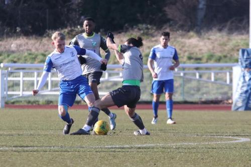 Enfields Ryan Blackman (L) challenges Dan Gallagher