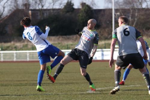 Enfields Sam Youngs (L) challenges Sean Clohessy