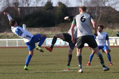Enfields Sam Youngs (L) challenges Sean Clohessy24