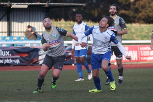 Enfields Sam Youngs (R) and Leatherheads Sammy Moore keep their eyes on the ball