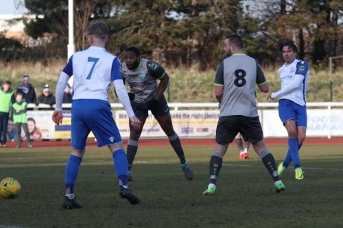 Enfields Sam Youngs (R) shoots